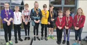  ?? Photo: Iain Ferguson, the Write Image. ?? Triathlon podium: winners Inverlochy Primary, centre, second-placed Lundavra, left, and third-placed Banavie.