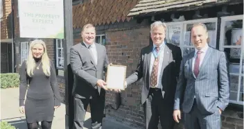  ??  ?? Darren Greenaway, chairman and trustee, accepts the award for The Greenaway Foundation in Crawley