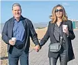  ?? ?? Sir Keir and Lady Starmer walk along the promenade to the conference in Brighton