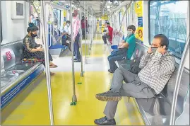  ??  ?? Commuters travel in a metro on the Ghatkopar- Versova corridor, which re-opened after being closed for nearly seven months due to Covid-19, in Mumbai on Monday