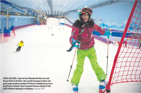  ?? Picture: AFP ?? COOL GLOVES. A girl at the Wanda Harbin Ice and Snow Park in Harbin, the world’s largest indoor ski park and a potent symbol of China’s ambitions to turn itself into a winter sports powerhouse ahead of the 2022 Winter Olympics in Beijing.