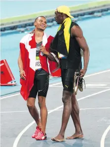  ?? ATP/WENN.COM ?? Andre De Grasse will not get a final chance to unseat Jamaican sprinting legend Usain Bolt as the Fastest Man in the World at the world championsh­ips in London after suffering a hamstring injury.