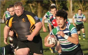  ??  ?? Stephen Horan of Gorey races away from Malahide’s Mikey Tyrrell.