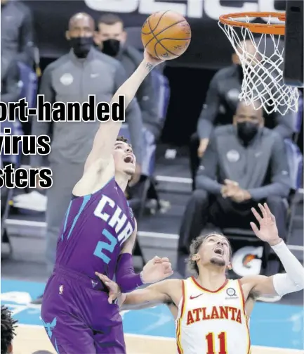  ?? (Photo: AFP) ?? Lamelo Ball (#2) of the Charlotte Hornets attempts a shot during the third quarter of their game against the Atlanta Hawks at Spectrum Center on Saturday in Charlotte, North Carolina.