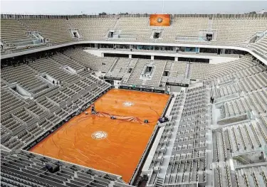  ?? Thomas Samson / AFP /Getty Images ?? Roland Garros won’t see French Open action until September after the tournament was postponed Tuesday.