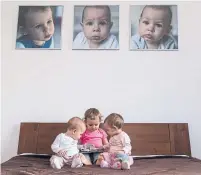  ?? DREAMSTIME ?? Borderless, large-format prints of a family’s young children create a focal point in a bedroom.