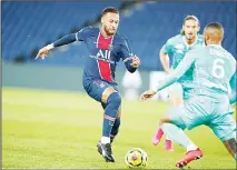  ??  ?? PSG’s Neymar (left), battles for the ball with Angers’ Enzo Ebosse during the French League One soccer match between Paris Saint-Germain and Angers at the Parc des Princes in Paris, France, on Oct 2. (AP)