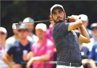  ?? ASSOCIATED PRESS PHOTOS ?? Abraham Ancer watches his tee shot on No. 3 at TPC Potomac at Avenel Farm during the third round of the Quicken Loans National on Saturday in Potomac, Md. Ancer shot an 8-under 62 to share the lead with Francesco Molinari.