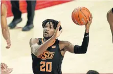  ?? NEIBERGALL] ?? Oklahoma State guard Keylan Boone shoots during the second half of an 81-60 win at Iowa State on Jan. 25 in Ames, Iowa. [AP PHOTO/CHARLIE