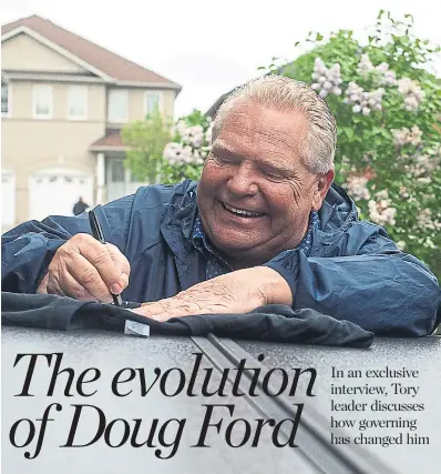  ?? EDUARDO LIMA FOR THE TORONTO STAR ?? Doug Ford autographs a T-shirt while canvassing on Sunday in Vaughan — the home turf of Liberal rival Steven Del Duca.