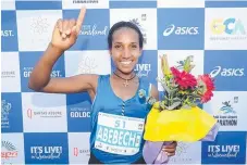  ?? Picture: RICHARD GOSLING ?? Abebech Bekele celebrates her win.