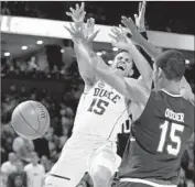  ?? Gregory Shamus Getty Images ?? FRANK JACKSON of Duke loses the ball as he tries to drive against South Carolina defenders.