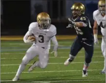  ?? PETE BANNAN – DIGITAL FIRST MEDIA ?? West Chester Rustin’s Michael Covert (3) picks up a first down against Sun Valley in the first quarter.