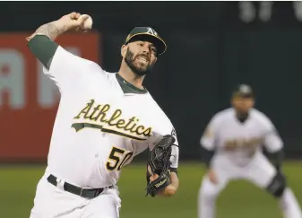  ?? Jeff Chiu / AP ?? Mike Fiers, who re-signed as a free agent, was 12-8 with a 3.56 ERA last season, including 5-2 and 3.74 with the A’s after a deal with Detroit. The A’s remain in the market for more starters.