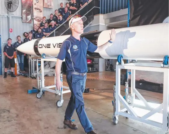  ?? Picture: TIM MARSDEN ?? CEO Adam Gilmour with the one vision rocket that will be used as part of Gilmour Space Technologi­es’ first flight.