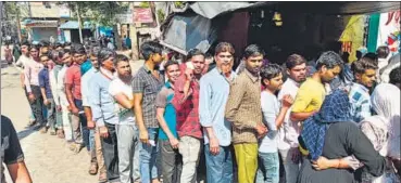  ?? ?? Braving heat wave conditions, people seen waiting for their turn at a polling booth in Aligarh.