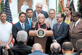  ?? RICARDO ARDUENGO/GETTY-AFP ?? Gov. Wanda Vazquez talks to reporters after signing a law in favor of cockfighti­ng.