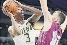  ?? Hans Pennink / Special to the Times Union ?? Manny Camper, left, is developing into a swingman for Siena. The former high school QB plays shooting guard, small forward and power forward.