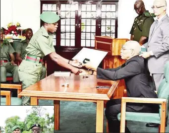  ??  ?? Second Lieutenant Brandi Johnson, the only female to be commission­ed receiving her Instrument of Commission from President David Granger.