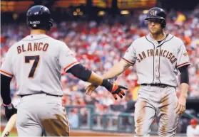  ?? Tom Mihalek / Associated Press 2013 ?? 2013: Gregor Blanco (left), Hunter Pence and the Giants anticipate­d the team making moves on trade-deadline day in Philadelph­ia. Pence begged to stay, and he did.