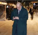  ?? TOM HANSON/THE CANADIAN PRESS FILE PHOTO ?? Then prime minister Paul Martin checks his BlackBerry during a trip to Davos, Switzerlan­d, in 2004.