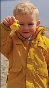  ?? BARB AGUIAR/The Daily Courier ?? Finlay Airth, 3, shows off his rubber ducky ready to bob down Trepanier Creek in one of the kiddie duck races.