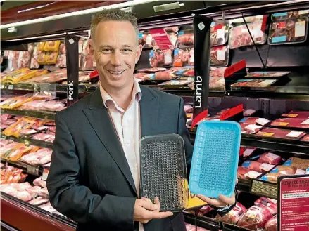  ?? SUPPLIED ?? Foodstuffs’ Mike Sammons shows recyclable meat trays, about to be introduced nationally.