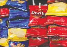  ?? MARK LENNIHAN/THE ASSOCIATED PRESS FILES ?? Cool Ranch Doritos are out of production, one of dozens, of products temporaril­y halted in March as manufactur­ers struggled to keep pace with the demand for snacks.