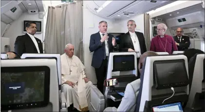  ?? TIZIANA FABI - VIA THE ASSOCIATED PRESS ?? During an airborne press conference Sunday are, from left, Pope Francis,the Moderator of the General Assembly of the Church of Scotland Iain Greenshiel­ds, and the Archbishop of Canterbury Justin Welby.