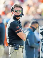  ?? [SARAH PHIPPS/ THE OKLAHOMAN] ?? Oklahoma State head coach Mike Gundy said a few weeks ago he didn't have detailed plans for what would happen if he was sidelined by COVID-19. But he suspects there will come a time this season when he'll need one.