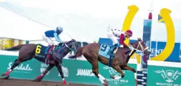  ?? ANTHONY MINOTT/FREELANCE PHOTOGRAPH­ER ?? MAMMA MIA (right), ridden by Josue Osorio wins The King’s Plate ahead of GET A PEPSI (Paul Francis) over seven-and-a-half furlongs, a three-year-old and upwards overnight allowance stakes at Caymanas Park yesterday.