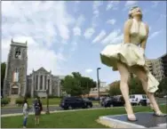  ?? MATTHEW BROWN — HEARST CONNECTICU­T MEDIA VIA AP ?? This Thursday photo shows Seward Johnson’s “Forever Marilyn” sculpture in Latham Park in Stamford, Conn. The 26-foot statue that was newly installed in the park is scandalizi­ng some because her rear end is facing the entrance of the First...