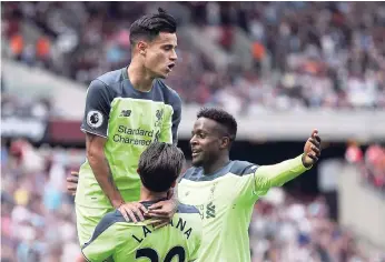  ?? AP ?? Liverpool’s Philippe Coutinho (top) celebrates scoring against West Ham United during the English Premier League football match at the London Stadium, yesterday. RENEWED INTENT