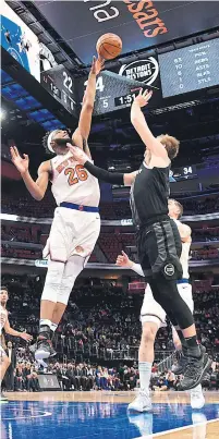  ?? CHRIS SCHWEGLER NBAE/GETTY IMAGES ?? Mitchell Robinson, left, blocks more than 10 per cent of opponents’ shots while on the floor for the New York Knicks.