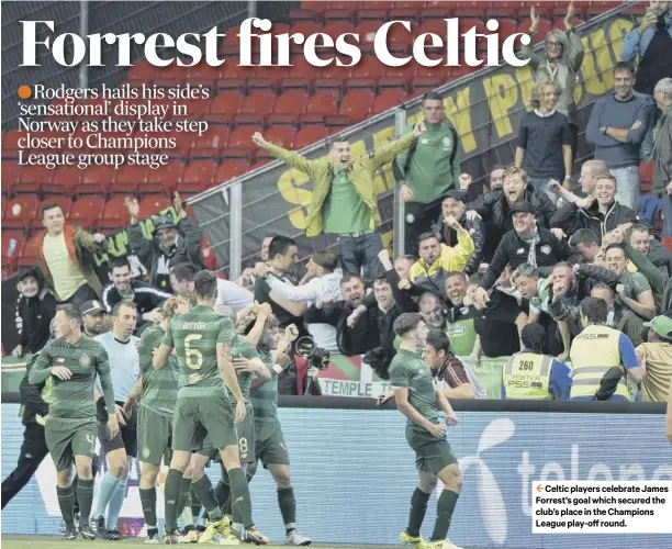  ??  ?? 2 Celtic players celebrate James Forrest’s goal which secured the club’s place in the Champions League play-off round.