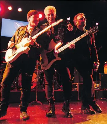  ?? THE ASSOCIATED PRESS ?? The Edge, left, Adam Clayton and Bono perform at the 13th MusiCares MAP Fund benefit concert in New York. The fund offers musicians access to addiction recovery treatment.