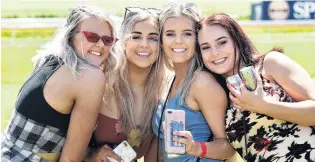  ?? PHOTO: PETER MCINTOSH ?? Girls’ day out . . . Racegoers (from left) Jordyn Patterson (18) Holly Ellis (19) Tayla Martin (18) and Caitlin Thomson (18), all of Dunedin, pose in the sun.