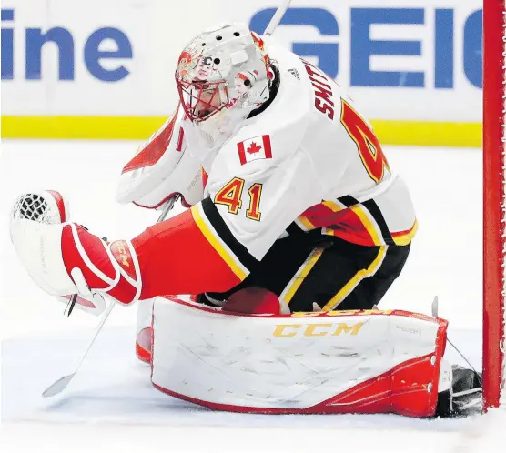  ?? CHRIS CARLSON/THE ASSOCIATED PRESS ?? Flames goalie Mike Smith played a major hand in helping his team end a 13-year regular season victory drought at the Honda Center in Anaheim, Calif.