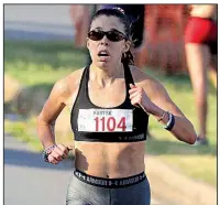  ?? Arkansas Democrat-Gazette/STATON BREIDENTHA­L ?? Kaitlin Bounds of Russellvil­le won the women’s division of Wednesday’s race, finishing in 17 minutes, 44.18 seconds.