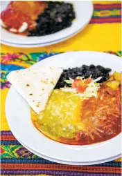  ?? PHOTOS BY GABRIELA CAMPOS/THE NEW MEXICAN ?? LEFT: Sagche’s Coffee House’s huevos rancheros and breakfast burrito served with a side of black beans.