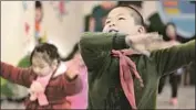  ??  ?? A CHILD at the Hope school dances in a P.E. class. Many children live with their grandparen­ts as their parents work distant jobs and can’t bring them.