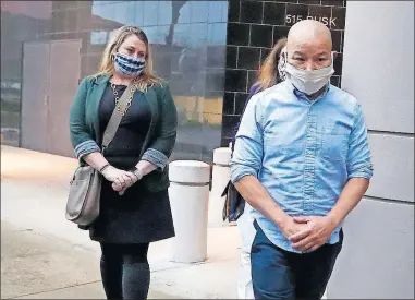  ?? [KAREN WARREN/HOUSTON CHRONICLE VIA THE ASSOCIATED PRESS] ?? Former Houston Police Officer Tam Pham walks out of the Federal Courthouse in Houston on Thursday after he appeared in court following his arrest Wednesday on federal charges tied to Capitol violence. Police department­s across the country are reviewing the behavior of dozens of officers who were in Washington on the day of a riot at the U.S. Capitol.