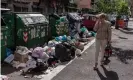 ?? Photograph: Stefano Montesi/Corbis/Getty Images ?? Waste overflows on the street in the Cinecittà neighbourh­ood.