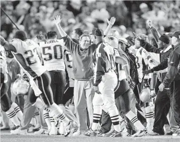  ?? MARK J. TERRILL AP ?? Bill Belichick (center) celebrates New England’s win over the San Diego Chargers in 2006 AFC Divisional playoff.