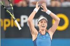  ?? /AFP ?? Demolition: Johanna Konta of Britain celebrates victory over Agnieszka Radwanska at the Sydney Internatio­nal.