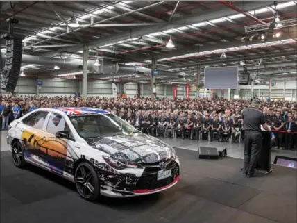  ?? THE ASSOCIATED PRESS ?? The last Toyota car produced in Australia is displayed for gathered workers in Melbourne on Tuesday.