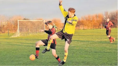  ??  ?? Valley clash with Bryngwran Bulls (yellow) in the Bwlch Car Boot Cup. Picture: WYNNE EVANS