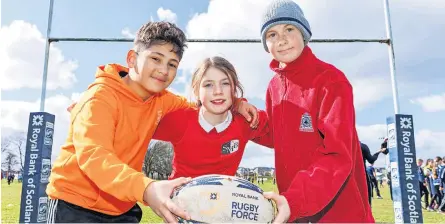  ?? ?? Rugby fun Taylan Ozutok (Braehead), Lea Gillies (St Mary’s) and Rhys Dickson (Borestone)