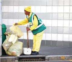  ?? PICTURE: WILLEM LAW ?? ON THE JOB: CCID cleaning teams sweep up to 1 020 tonnes of excess street waste annually.