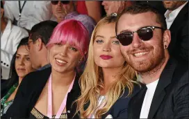  ??  ?? Serving up smiles: Laura with Amber Le Bon, left, and Sam Smith
